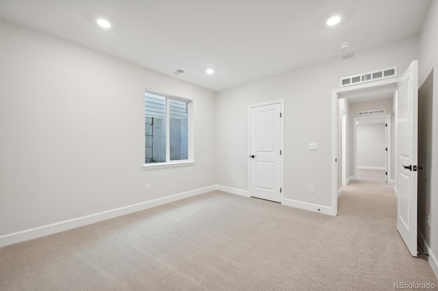 unfurnished bedroom featuring light colored carpet