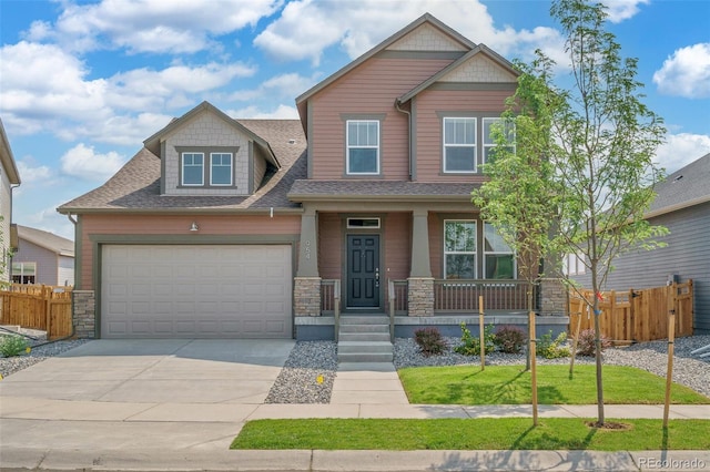 954 Plum Creek Ct, Brighton, CO 80601 - craftsman house featuring stone siding, covered porch, driveway, roof with shingles, and a garage