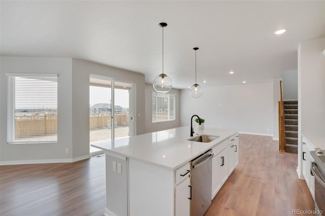 954 Plum Creek Ct, Brighton, CO 80601 - kitchen featuring appliances with stainless steel finishes, light wood-style floors, light countertops, and recessed lighting