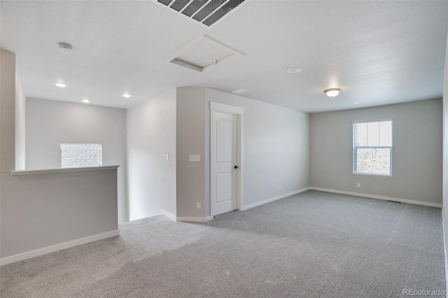 954 Plum Creek Ct, Brighton, CO 80601 - carpeted spare room with attic access, a smoke detector, and recessed lighting