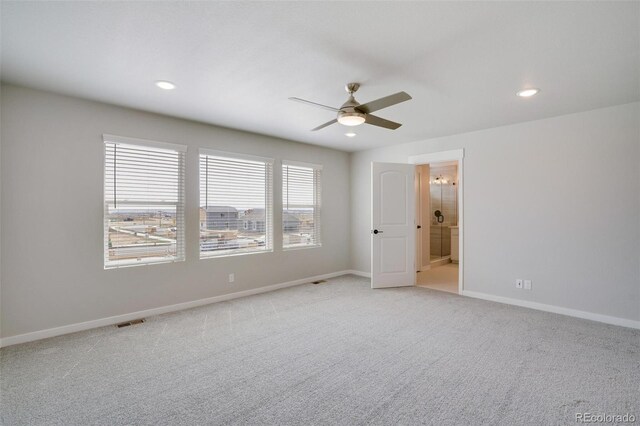 954 Plum Creek Ct, Brighton, CO 80601 - unfurnished bedroom featuring light carpet, recessed lighting, ensuite bath, and a ceiling fan