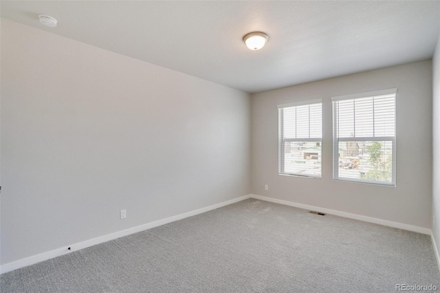 954 Plum Creek Ct, Brighton, CO 80601 - empty room featuring light colored carpet and a smoke detector