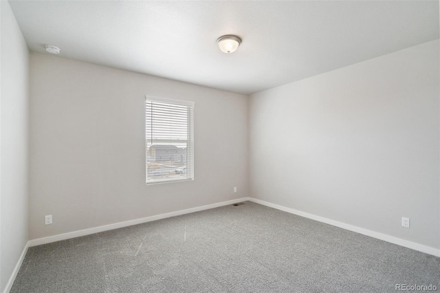 954 Plum Creek Ct, Brighton, CO 80601 - empty room featuring a smoke detector and carpet floors