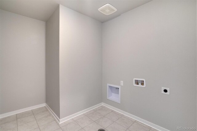 954 Plum Creek Ct, Brighton, CO 80601 - laundry room with hookup for an electric dryer, washer hookup, and light tile patterned floors