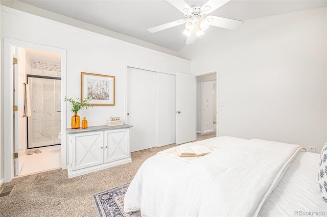 bedroom with ceiling fan, a closet, connected bathroom, and light colored carpet