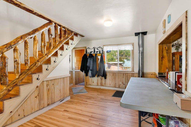 68600 State Highway 69, Westcliffe, CO 81252 - interior space featuring wood finished floors, wooden walls, stairs, and a wainscoted wall
