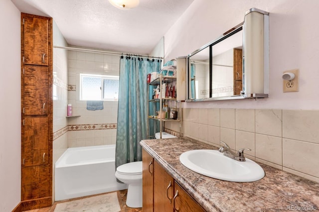 full bathroom featuring shower / tub combo, tile patterned floors, vanity, tile walls, and toilet