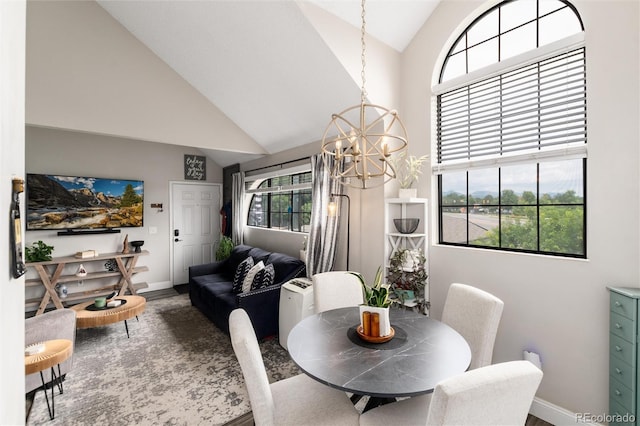 8311 S Upham Way Unit 1-207, Littleton, CO 80128 - dining room with high vaulted ceiling and a chandelier