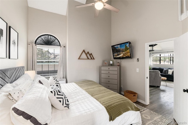 8311 S Upham Way Unit 1-207, Littleton, CO 80128 - bedroom featuring high vaulted ceiling, wood finished floors, and a ceiling fan