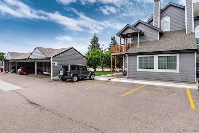 8311 S Upham Way Unit 1-207, Littleton, CO 80128 - view of partially covered parking lot