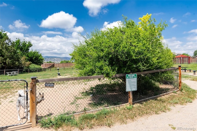 8311 S Upham Way Unit 1-207, Littleton, CO 80128 - exterior view of mountains and a gate