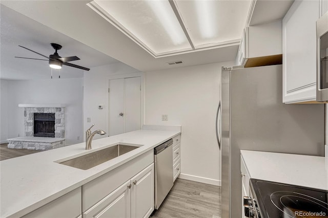 4283 S Salida Way Unit 8, Aurora, CO 80013 - kitchen featuring dishwasher, range with electric stovetop, light wood-style flooring, and light countertops