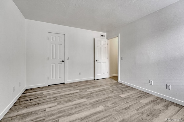 4283 S Salida Way Unit 8, Aurora, CO 80013 - unfurnished bedroom with wood finished floors and baseboards