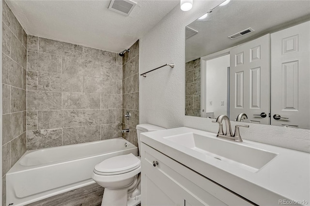 4283 S Salida Way Unit 8, Aurora, CO 80013 - bathroom featuring wood finished floors, vanity, shower / tub combination, and a textured ceiling