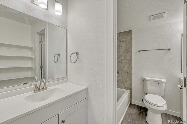 4283 S Salida Way Unit 8, Aurora, CO 80013 - bathroom featuring wood finished floors, vanity, shower / bathtub combination, and a textured wall