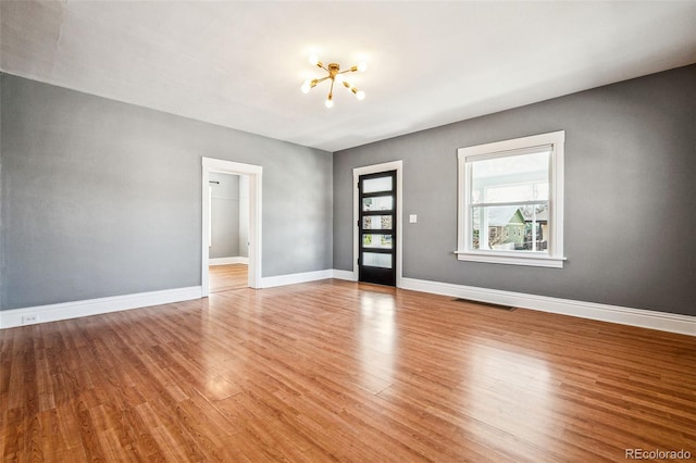 interior space featuring visible vents, baseboards, and light wood-style flooring