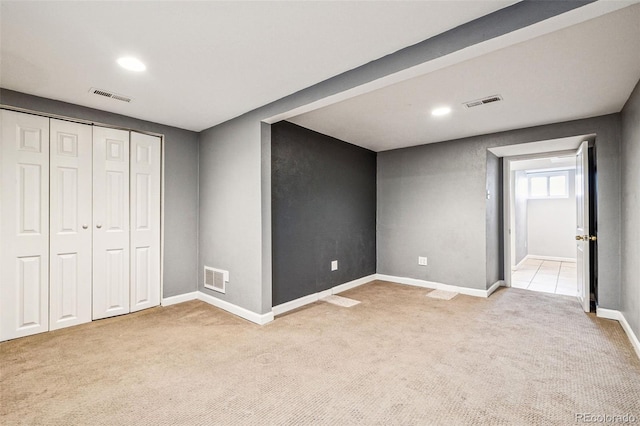 interior space with visible vents, baseboards, and carpet flooring