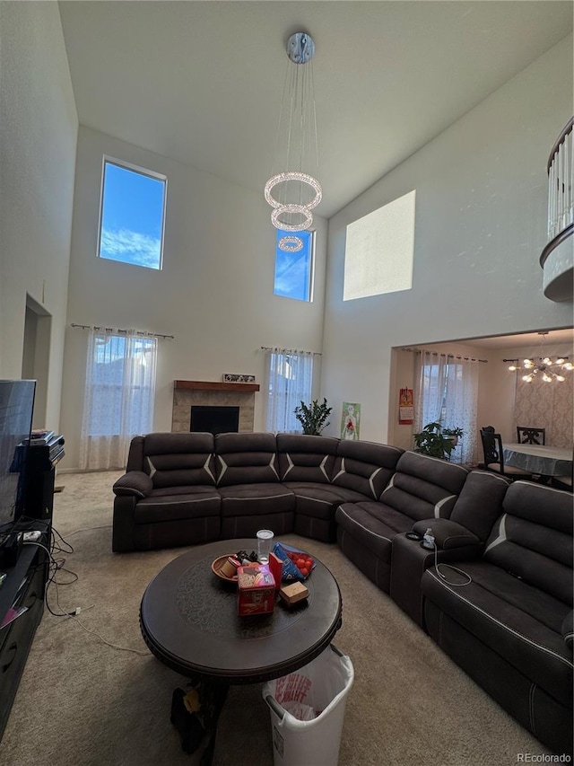 living room featuring an inviting chandelier and light carpet