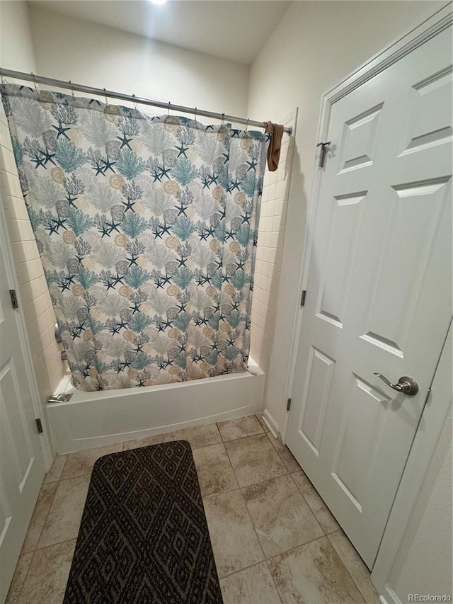 bathroom featuring tile patterned floors and shower / bath combo