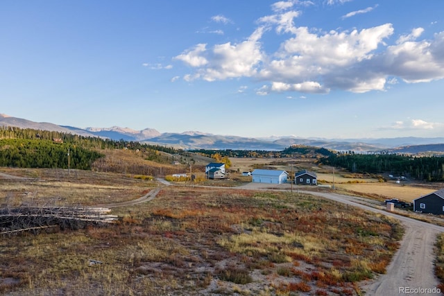 drone / aerial view featuring a mountain view and a rural view