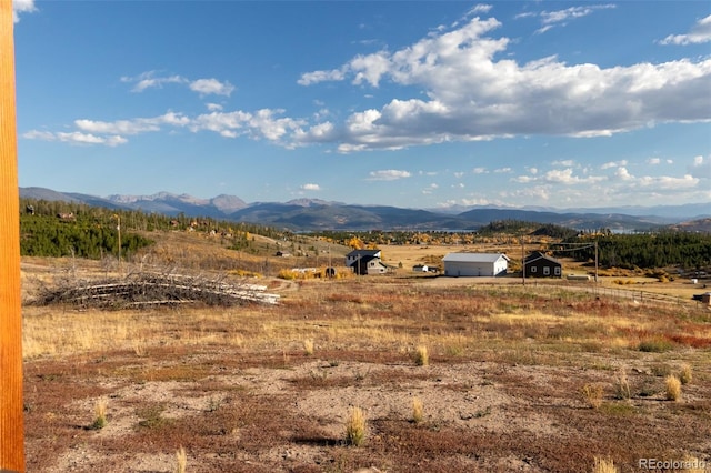 mountain view featuring a rural view