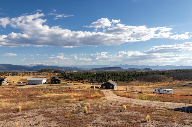 view of mountain feature with a rural view