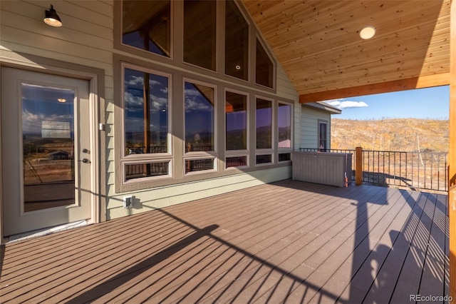 wooden deck featuring a mountain view