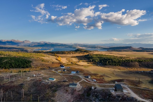 drone / aerial view featuring a mountain view and a rural view