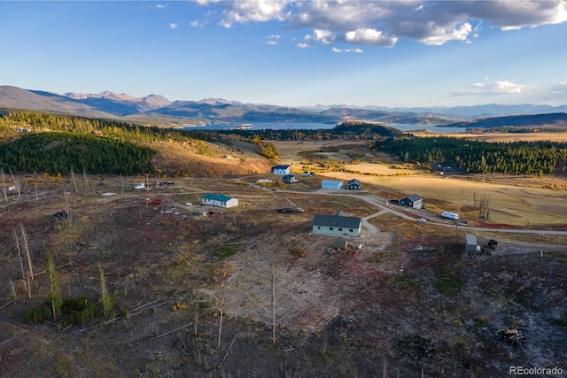 birds eye view of property with a mountain view and a rural view