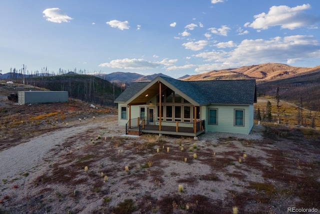 rear view of house with a mountain view