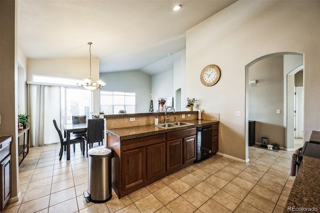 kitchen with lofted ceiling, arched walkways, light tile patterned flooring, a sink, and black dishwasher