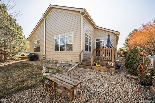 rear view of property with a deck