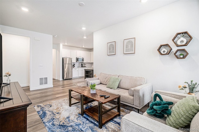 living room featuring light hardwood / wood-style flooring