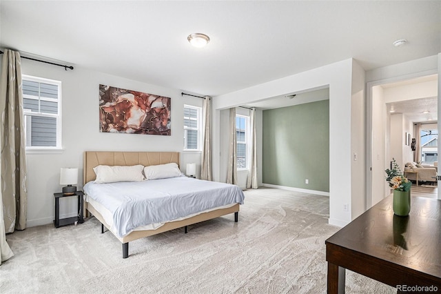 bedroom featuring light colored carpet