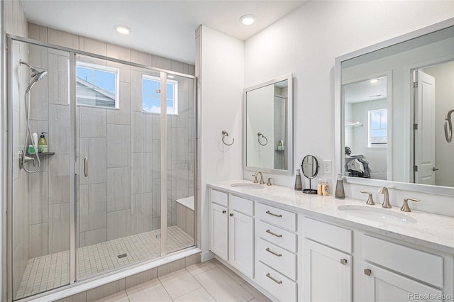 bathroom with vanity and an enclosed shower