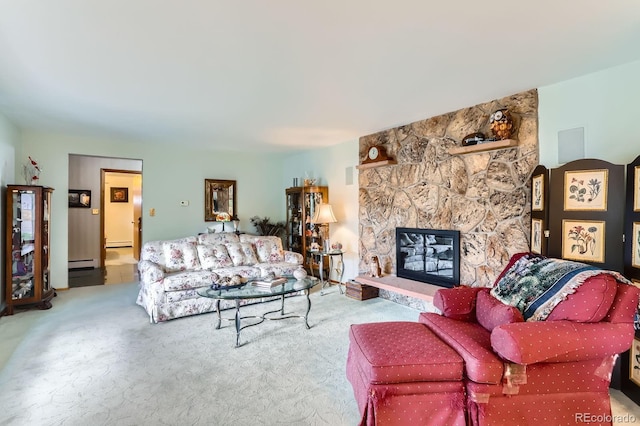 living area with a stone fireplace, carpet flooring, and a baseboard radiator