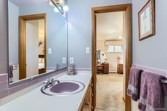 bathroom featuring vanity and a baseboard heating unit