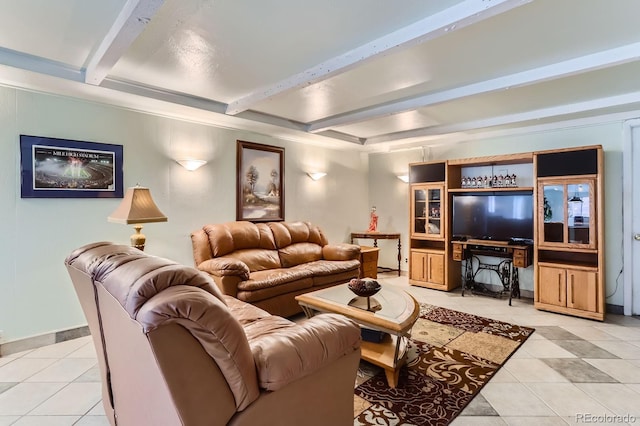 living area featuring baseboards, beam ceiling, and light tile patterned floors