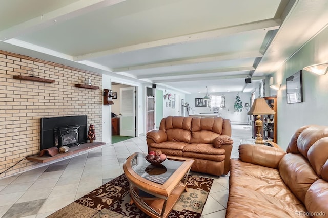living area with beam ceiling, a wood stove, and light tile patterned flooring