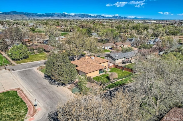 drone / aerial view featuring a residential view and a mountain view