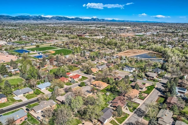 aerial view featuring a water and mountain view and a residential view
