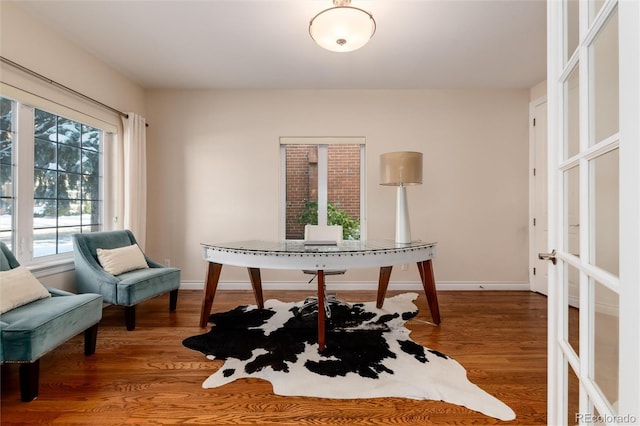 home office with wood-type flooring