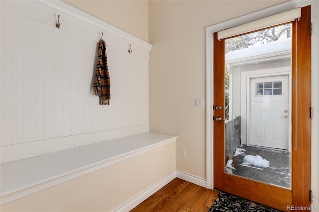 mudroom with wood finished floors and baseboards