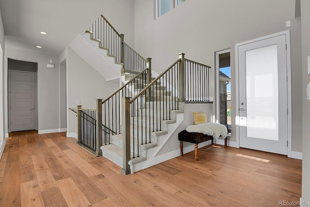 stairway with hardwood / wood-style flooring