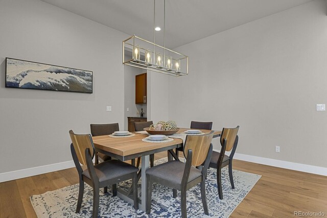 dining room with light wood-type flooring