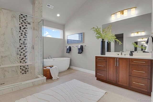 bathroom with lofted ceiling, vanity, tile patterned flooring, and shower with separate bathtub