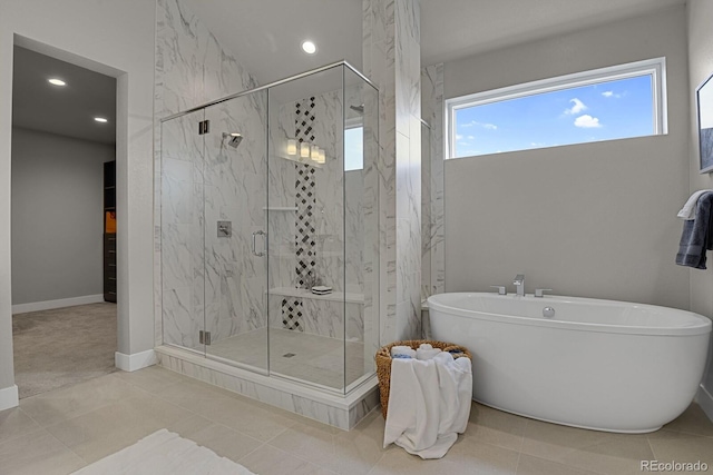 bathroom with independent shower and bath and tile patterned floors