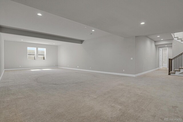 basement with light colored carpet