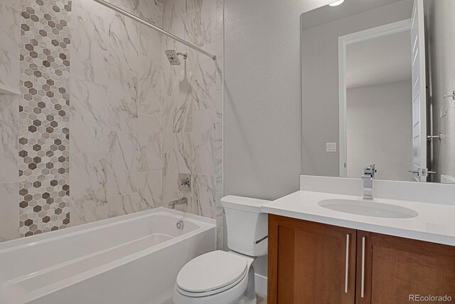 full bathroom featuring tiled shower / bath combo, vanity, and toilet