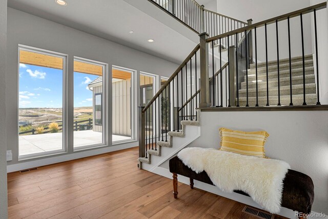 staircase featuring hardwood / wood-style flooring